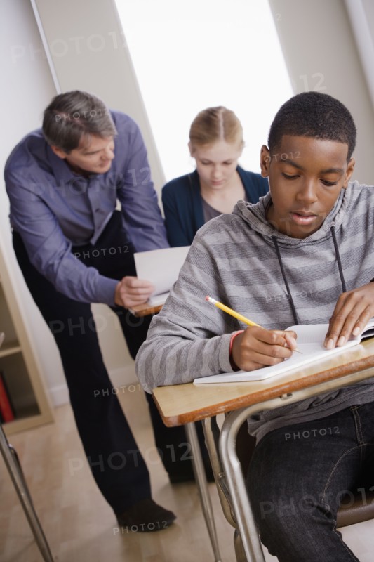 Teacher with teenage students (14-15) at school. 
Photo : Rob Lewine