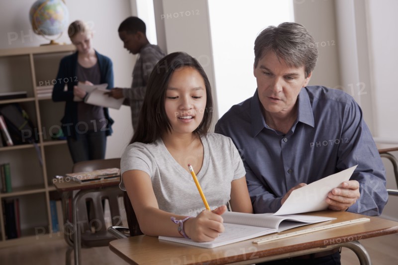 Teacher with teenage students (14-15) at school. 
Photo : Rob Lewine