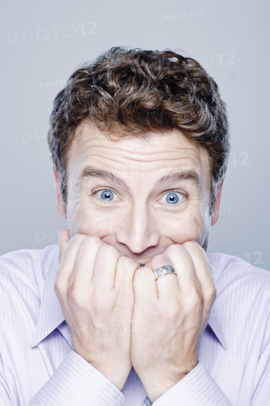 Portrait of worried mid adult man, studio shot. 
Photo: Rob Lewine