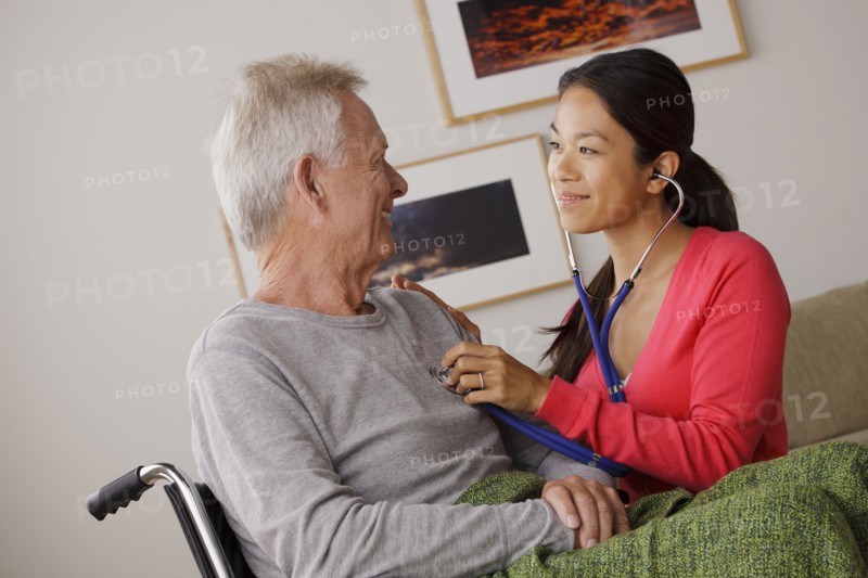 Young female nurse taking care of senior man. 
Photo : Rob Lewine