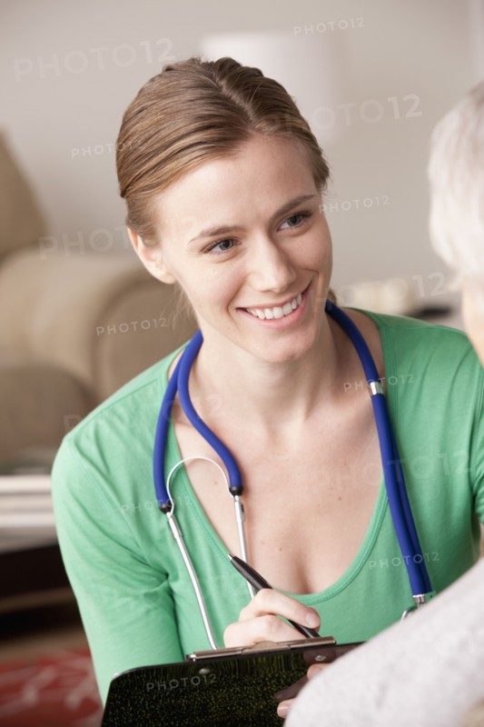 Female nurse with senior patient at home. 
Photo: Rob Lewine
