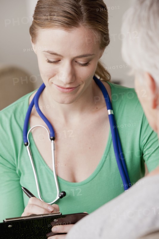 Female nurse with senior patient at home. 
Photo: Rob Lewine