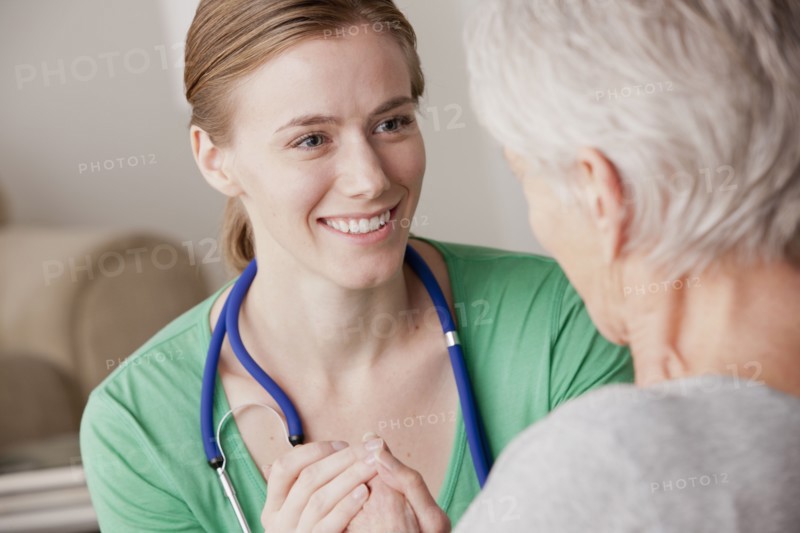 Female nurse with senior patient at home. 
Photo: Rob Lewine