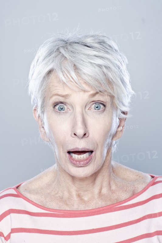 Portrait of surprised senior woman, studio shot. 
Photo: Rob Lewine