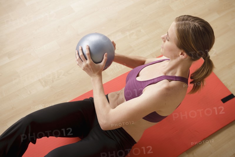 Young woman exercising. 
Photo: Rob Lewine