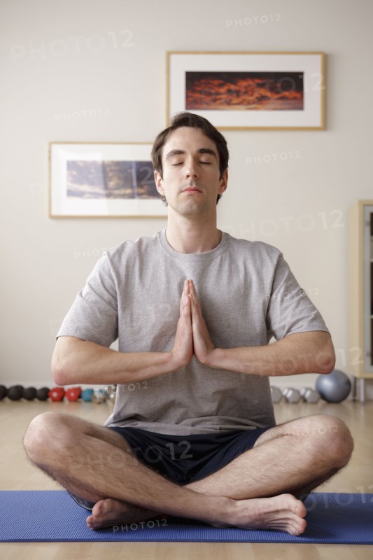 Young man meditating. 
Photo : Rob Lewine