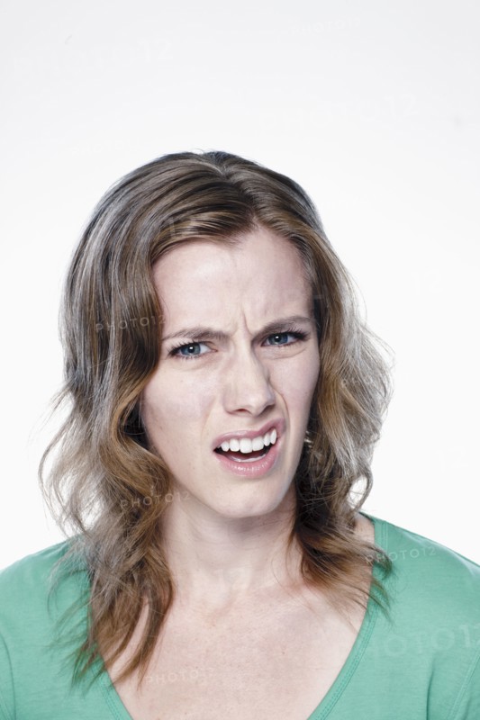Portrait of confused young woman, studio shot. 
Photo: Rob Lewine