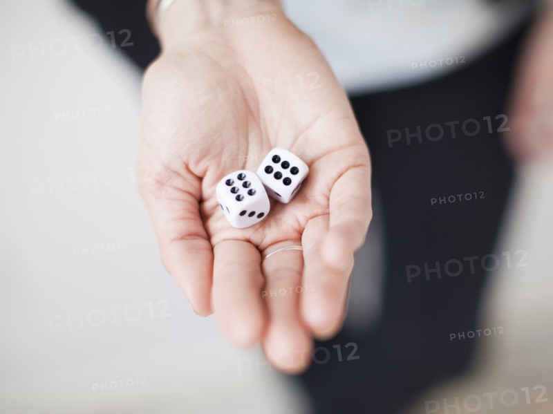 High angle view of hands with dices. 
Photo: Jessica Peterson