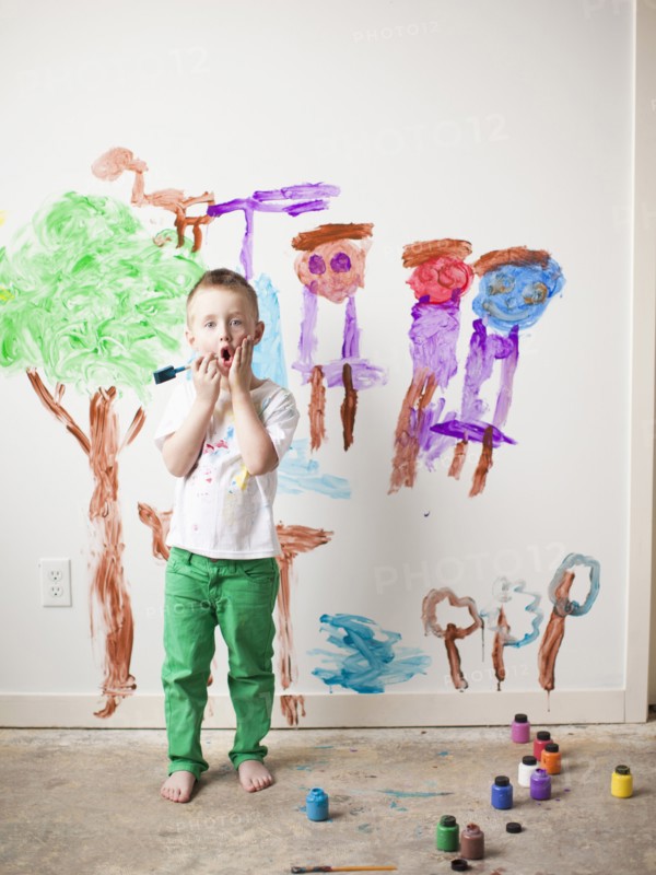 Toddler boy (2-3) painting on wall. 
Photo: Jessica Peterson