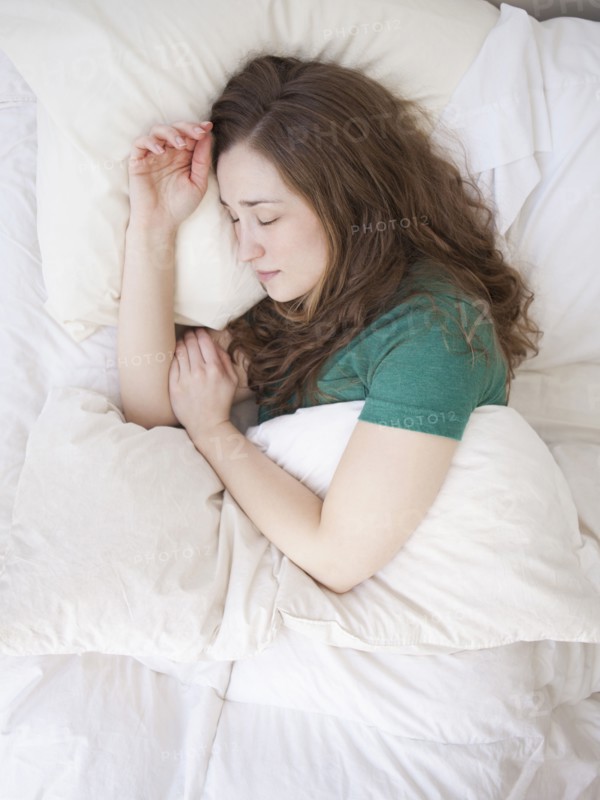 Young woman sleeping in bed. 
Photo : Jessica Peterson