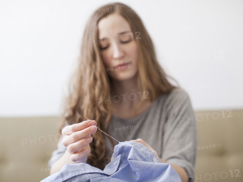 Young woman sawing. 
Photo: Jessica Peterson