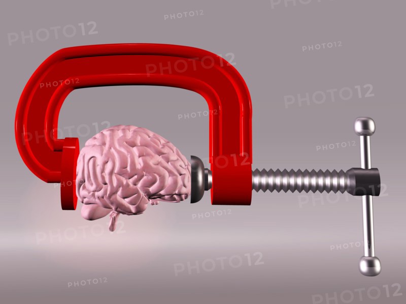 Studio shot of brain in squeezed by clamp. 
Photo: Calysta Images