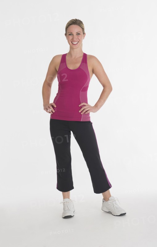 Studio portrait of woman in workout clothes.