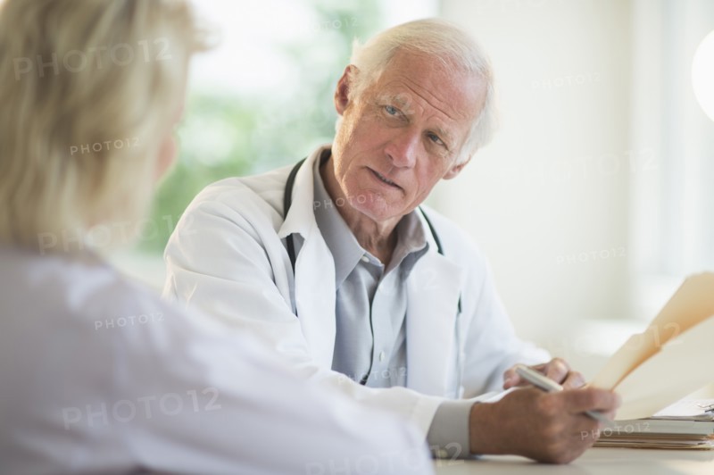 Female and male doctors discussing.