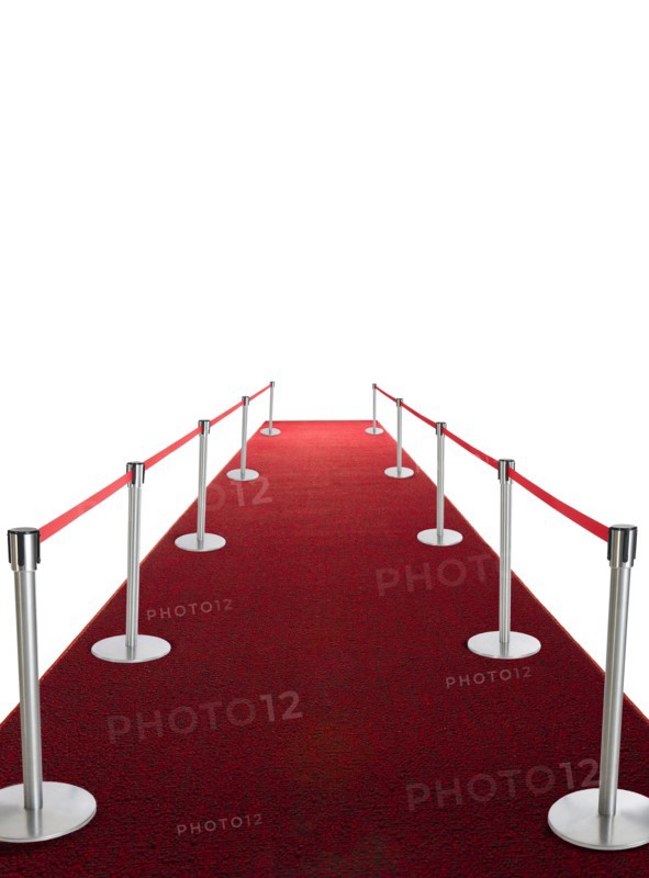 Studio shot of red carpet with stanchions and velvet rope.