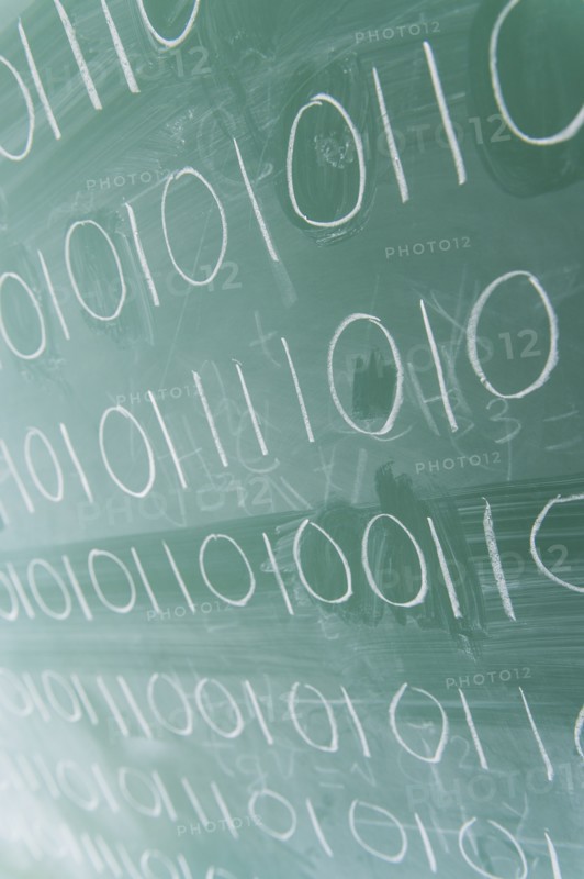 Binary code on blackboard.