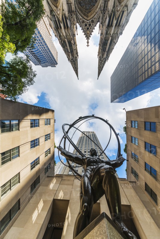 USA, New York City, Low angle view of statue outside Rockefeller Center.