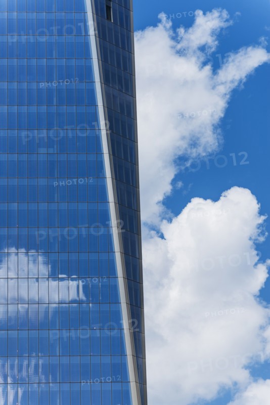 USA, New York City, Sky reflecting in World Trade Tower windows.