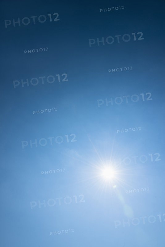 Clear blue sky and solar flare.
