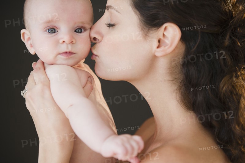Mother and baby boy (2-5 months) posing together. Photo: Jamie Grill