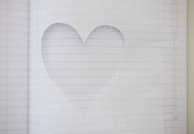 Heart shape cut out of note book. Photo : Jamie Grill