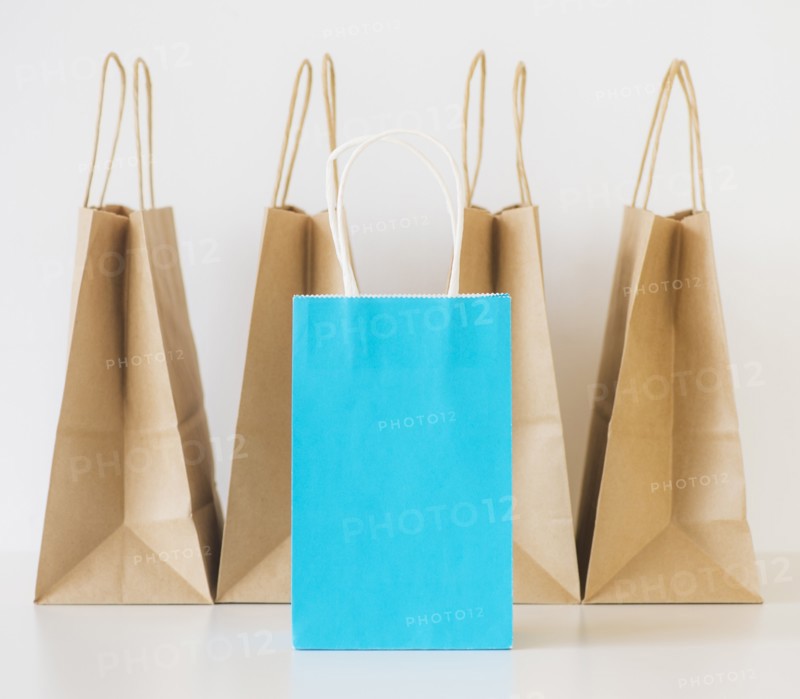 Studio shot of shopping bags and note book. Photo: Daniel Grill