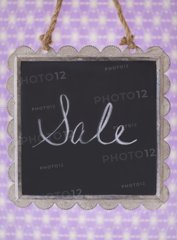 Studio shot of small blackboard with word Sale. Photo: Daniel Grill
