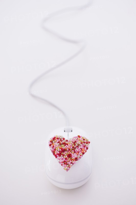 Colorful heart on computer mouse. Photo: Daniel Grill