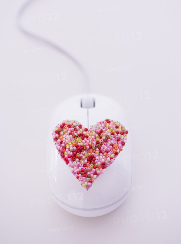 Colorful heart on computer mouse. Photo : Daniel Grill
