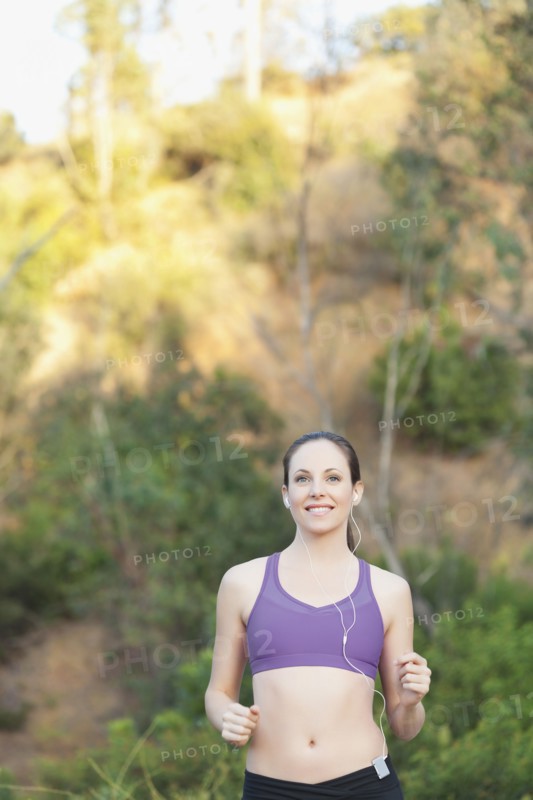 Woman running with headphones on. Photo: Sarah M. Golonka
