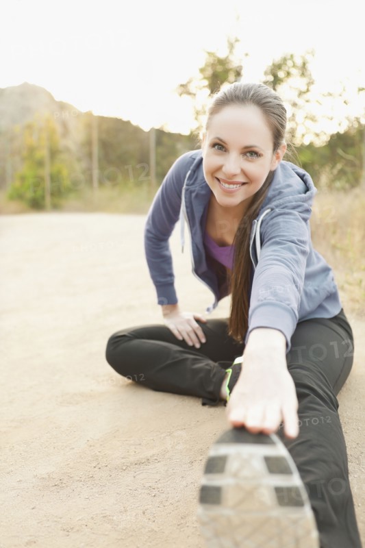 Woman exercising on dusty track. Photo: Sarah M. Golonka