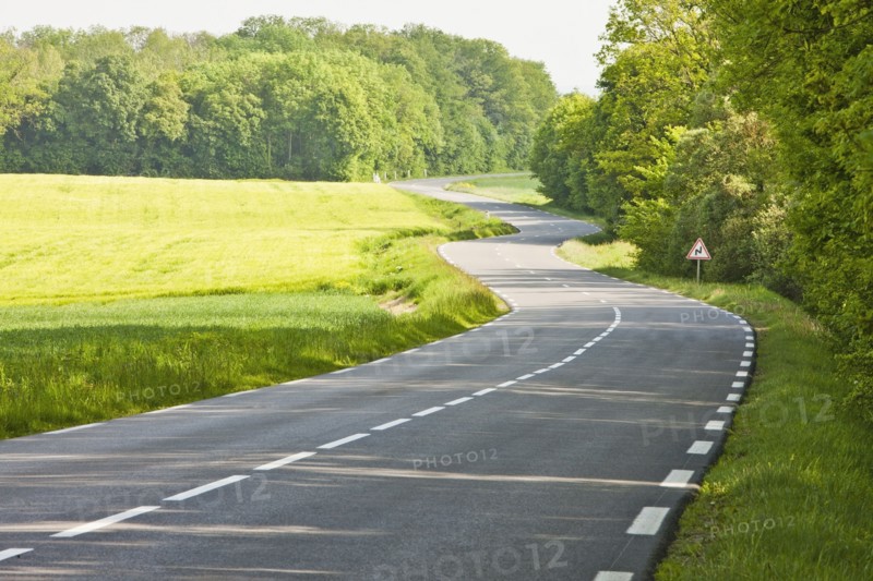 France, Rocroi, Road among green fields. Photo: Mike Kemp