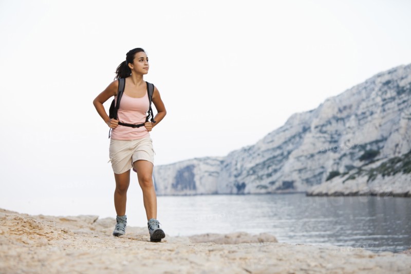 France, Marseille, Woman hiking on seaside. Photo: Mike Kemp