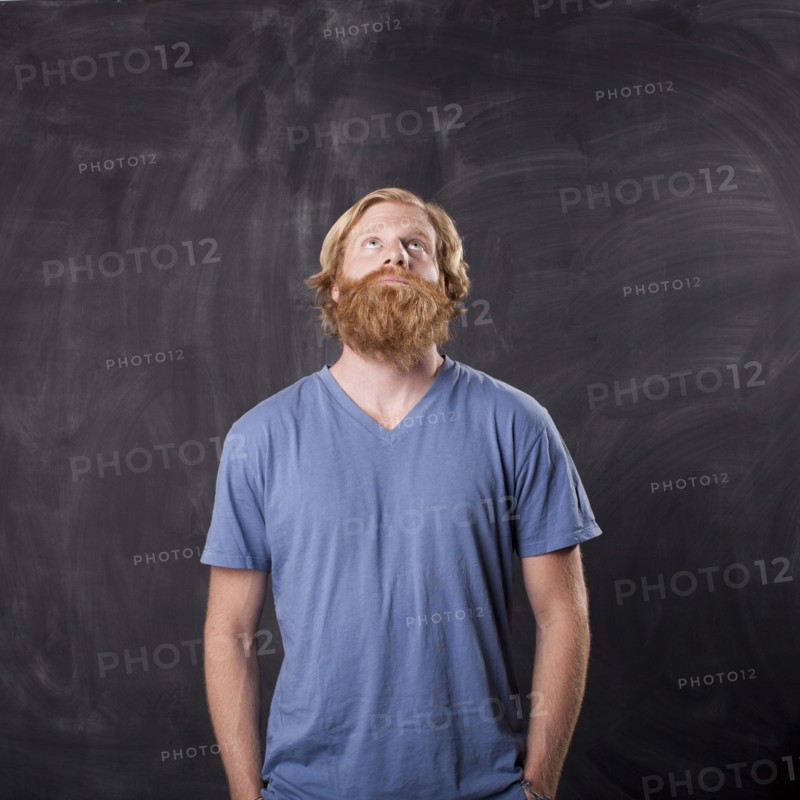 Man in front of blackboard. Photo: Jessica Peterson