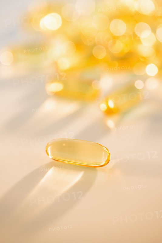 Omega fatty acid pills on white background, studio shot.