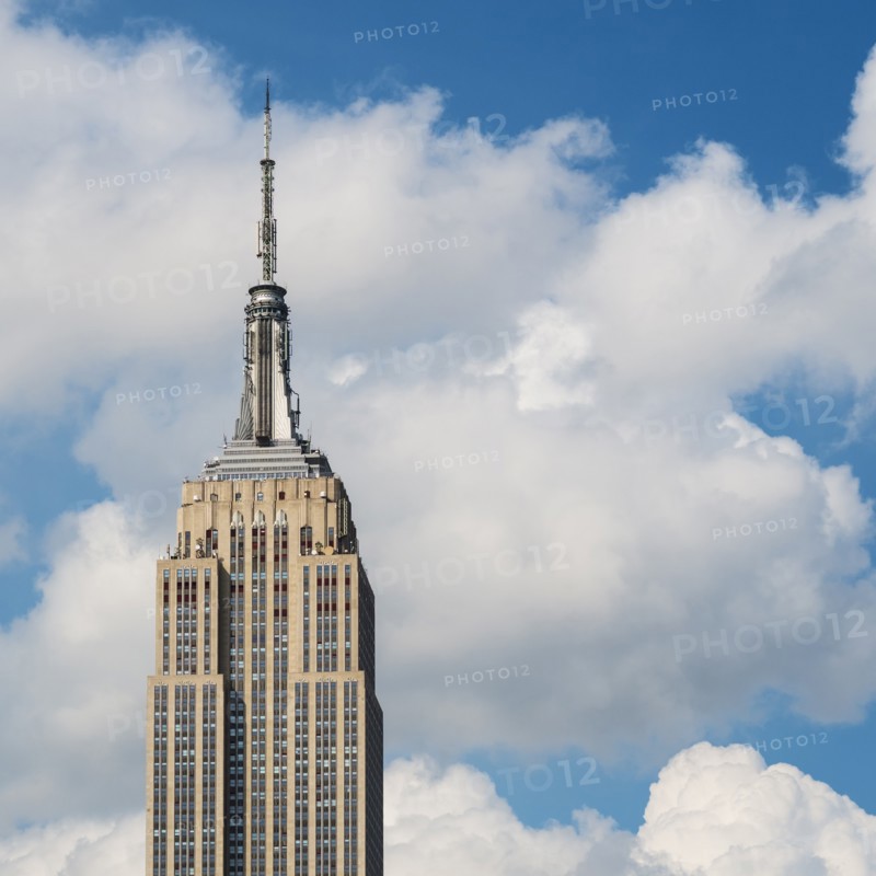 Empire State Building under blue sky.