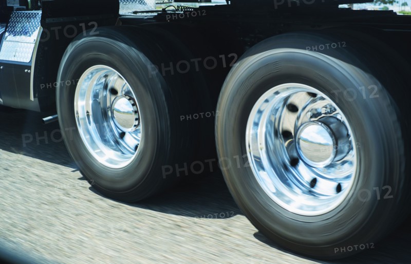 Wheels of truck in motion.