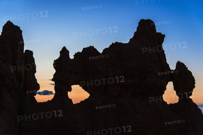Silhouette of rock at dusk.