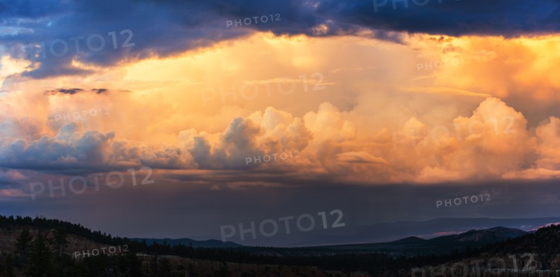 Clouds above valley at dusk.