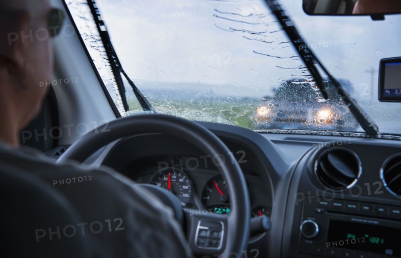 Man driving in rain.