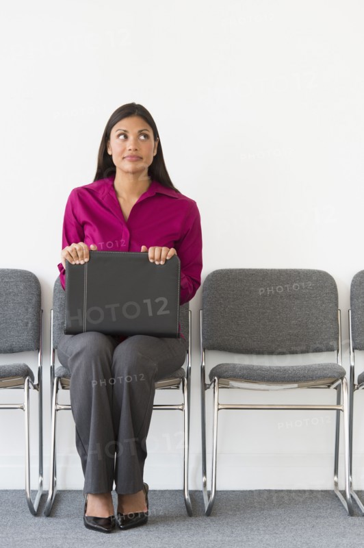 Woman sitting in waiting room.