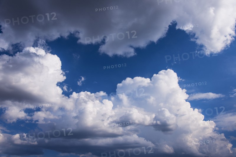 Puffy clouds on sky.