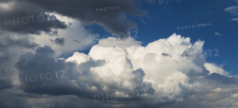 Puffy clouds on sky.