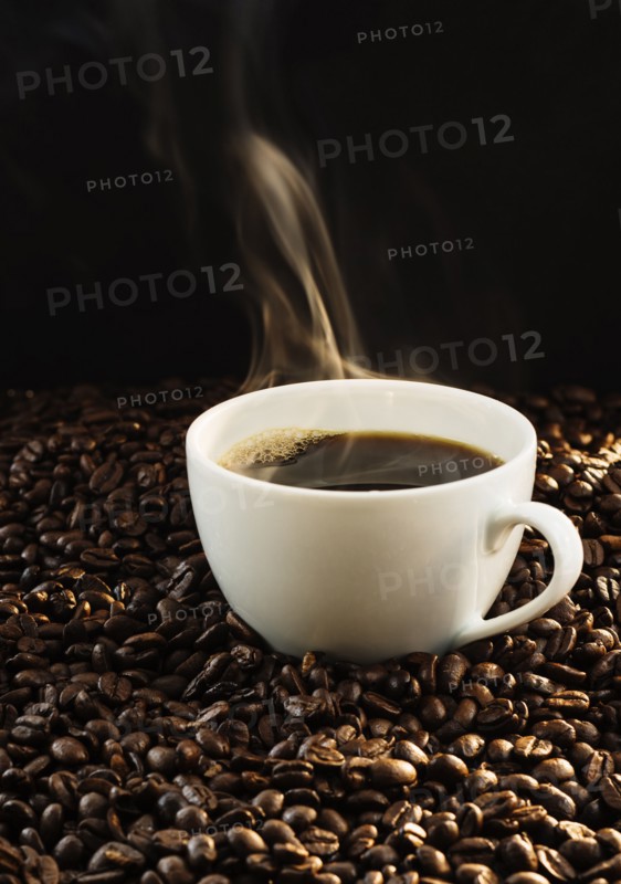 Hot coffee and coffee beans, studio shot.