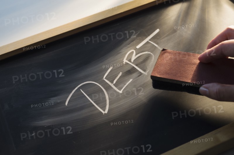 Close up of woman's hand over chalk board.