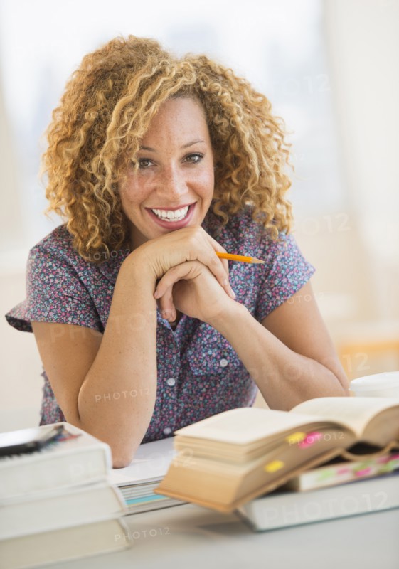 Young woman studying in library.