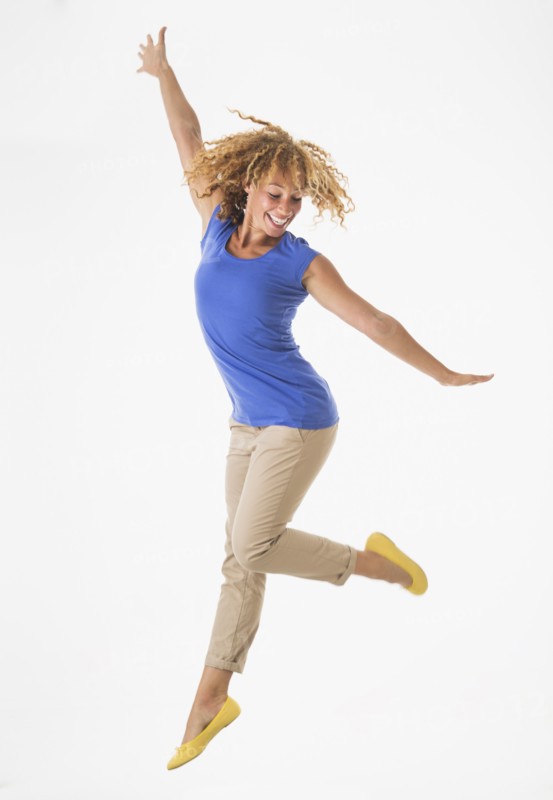 Woman jumping, studio shot.