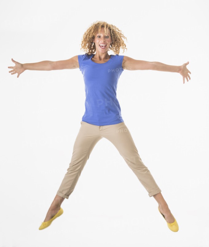 Woman jumping, studio shot.