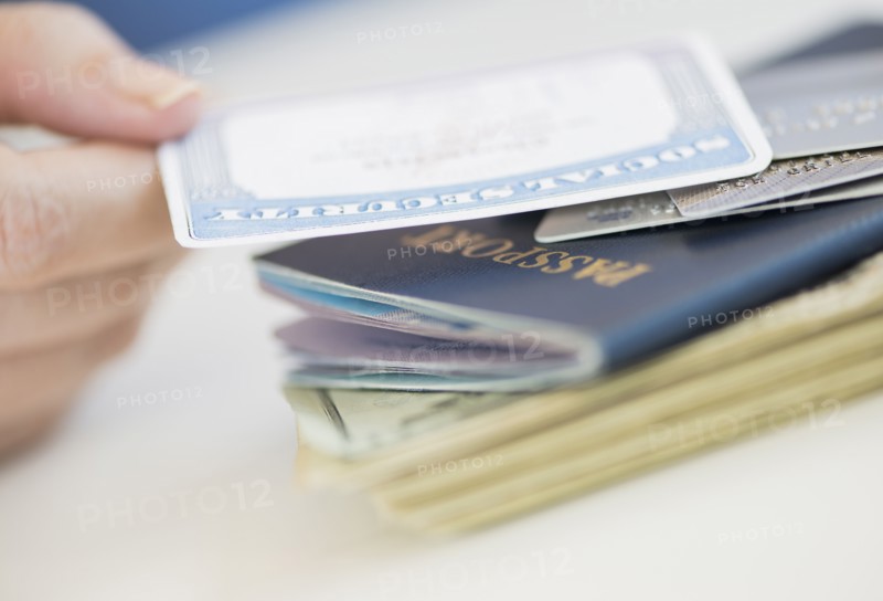 Close up of woman's hand holding Social Security Card.