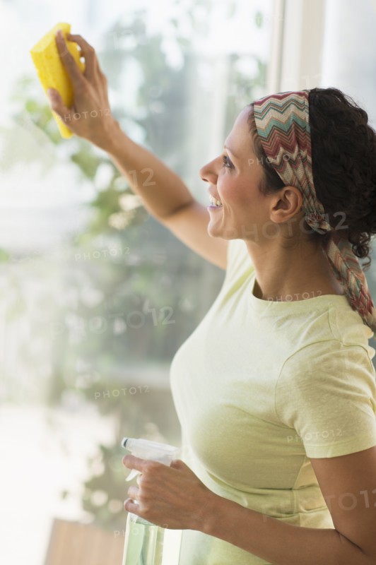 Woman cleaning window.